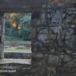 Photo by Peter Wynne of a stone wall with window of an abandoned cottage on the banks of the Boyne river, Navan, Co. Meath, Ireland at sunset.